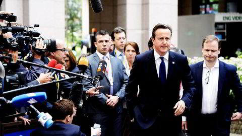 FESTBREMS. David Cameron er festbrems når EU-toppene skal feire Jean-Claude Junckers som Europakommisjonens neste president. Det kan koste britene makt og innflytelse. Foto: Virginia Mayo, AP/NTB Scanpix