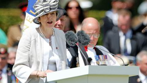 British Prime Minister Theresa May delivers a speech during the Royal British Legion’s commemoration ceremony to commemorate the 75th anniversary of D-Day, at the Commonwealth War Cemetery in Bayeux, France, June 6, 2019. REUTERS/Pascal Rossignol