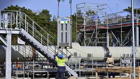 Men working at the construction site of the so-called Nord Stream 2 gas pipeline in Lubmin, northeastern Germany, on March 26, 2019.