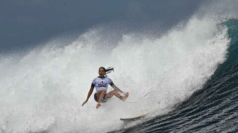 TOPSHOT - French surfer Vahine Fierro takes part in a surfing training session in Teahupo'o, on the French Polynesian Island of Tahiti on July 21, 2024, ahead of the Paris 2024 Olympic Games. (Photo by Jerome BROUILLET / AFP)
