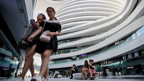Nesten en fjerdedel av kontorarealet i Kinas største byer står ledig. Leieprisene faller mens det ferdigstilles mange millioner kvadratemeter nye kontorareal i år. Her fra Galaxy Soho i Beijing.