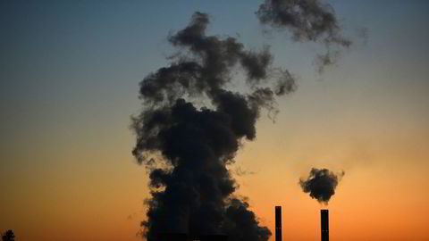 (FILES) This file photograph taken on October 2, 2015, shows smoke rising from the "Weisweiler" power plant which is run on brown coal from an open cast mine in Weisweiler, western Germany. - Avoiding global climate chaos will require a major transformation of society and the world economy that is "unprecedented in scale," the UN said October 8, 2018, in a landmark report that warns time is running out to avert disaster. (Photo by Patrik STOLLARZ / AFP) ---