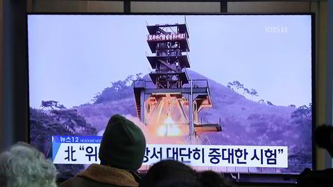 People watch a TV screen showing a file image of a ground test of North Korea's rocket engine during a news program at the Seoul Railway Station in Seoul, South Korea, Monday, Dec. 9, 2019. North Korea said Sunday it carried out a _very important test_ at its long-range rocket launch site that it reportedly rebuilt after having partially dismantled it after entering denuclearization talks with the United States last year. The sign reads: _Very important test._ (AP Photo/Ahn Young-joon)