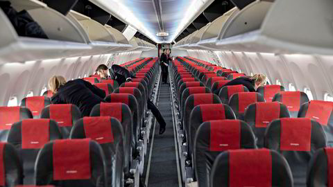En passasjer får refusjon fra Norwegian etter å ha betalt dyrt for flysete gjennom en prisauksjon.