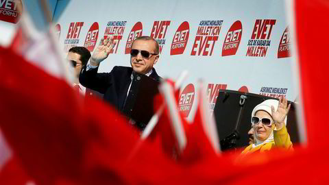 Turkish President Tayyip Erdogan and his wife Emine Erdogan greet their supporters during a rally for the upcoming referendum, in Izmir, Turkey, April 9, 2017. REUTERS/Umit Bektas ---