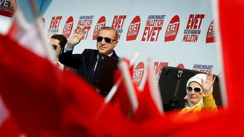 Turkish President Tayyip Erdogan and his wife Emine Erdogan greet their supporters during a rally for the upcoming referendum, in Izmir, Turkey, April 9, 2017. REUTERS/Umit Bektas ---
