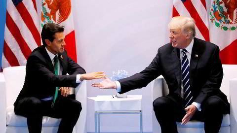 USAs president Donald Trump fotografert sammen med Mexicos president Enrique Pena Nieto i Hamburg, Tyskland i juli i fjor. Nå er tonen mellom de to en helt annen.